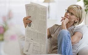 advisor page graphic silver hair woman reading newspaper